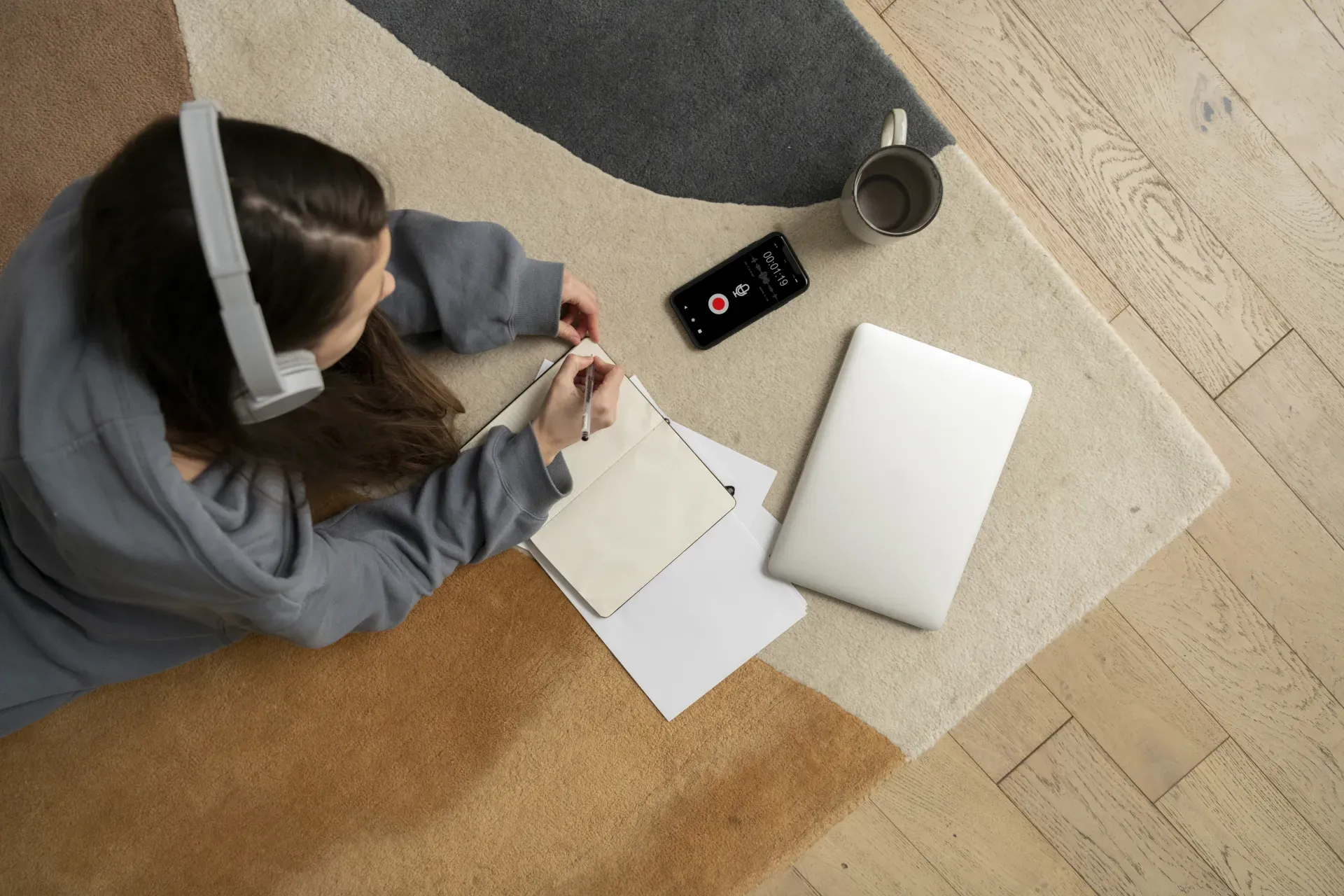 Woman Working Floor From Home With Device